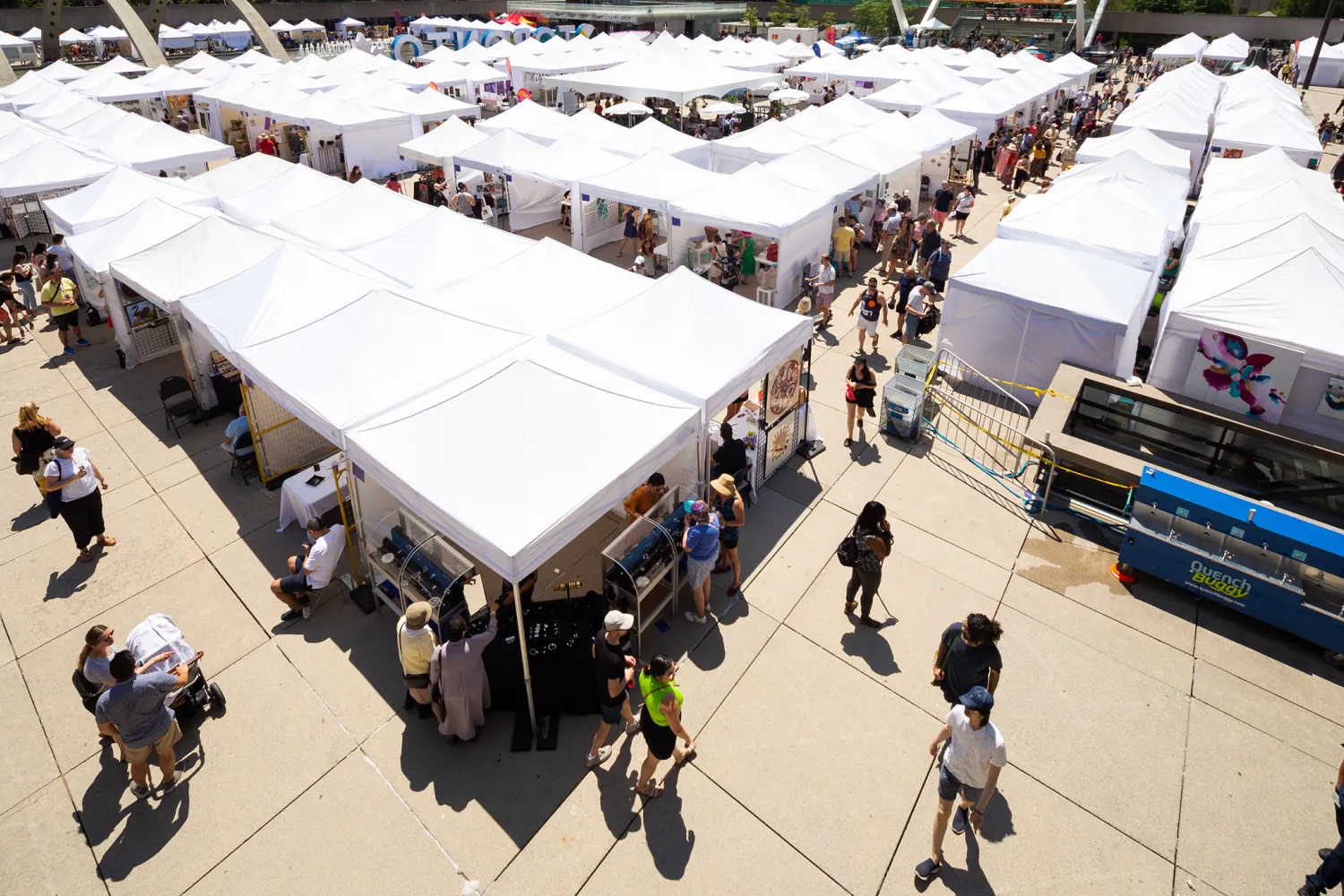 TOAF tents and visitors walking around.