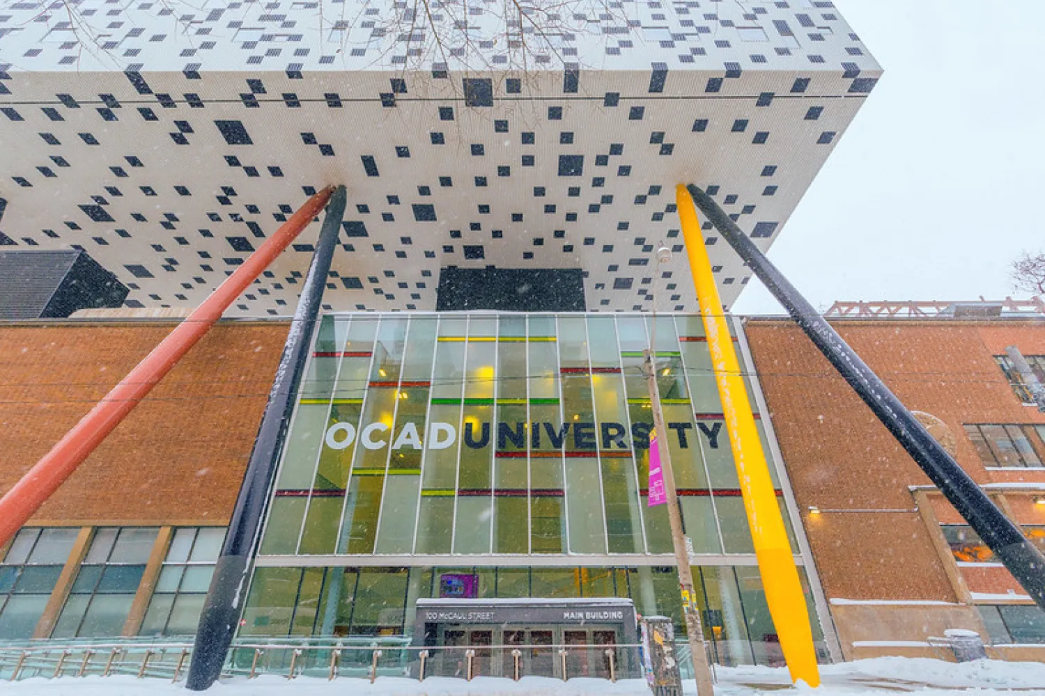 Photo of tabletop building over main OCAD U building with snow on the ground