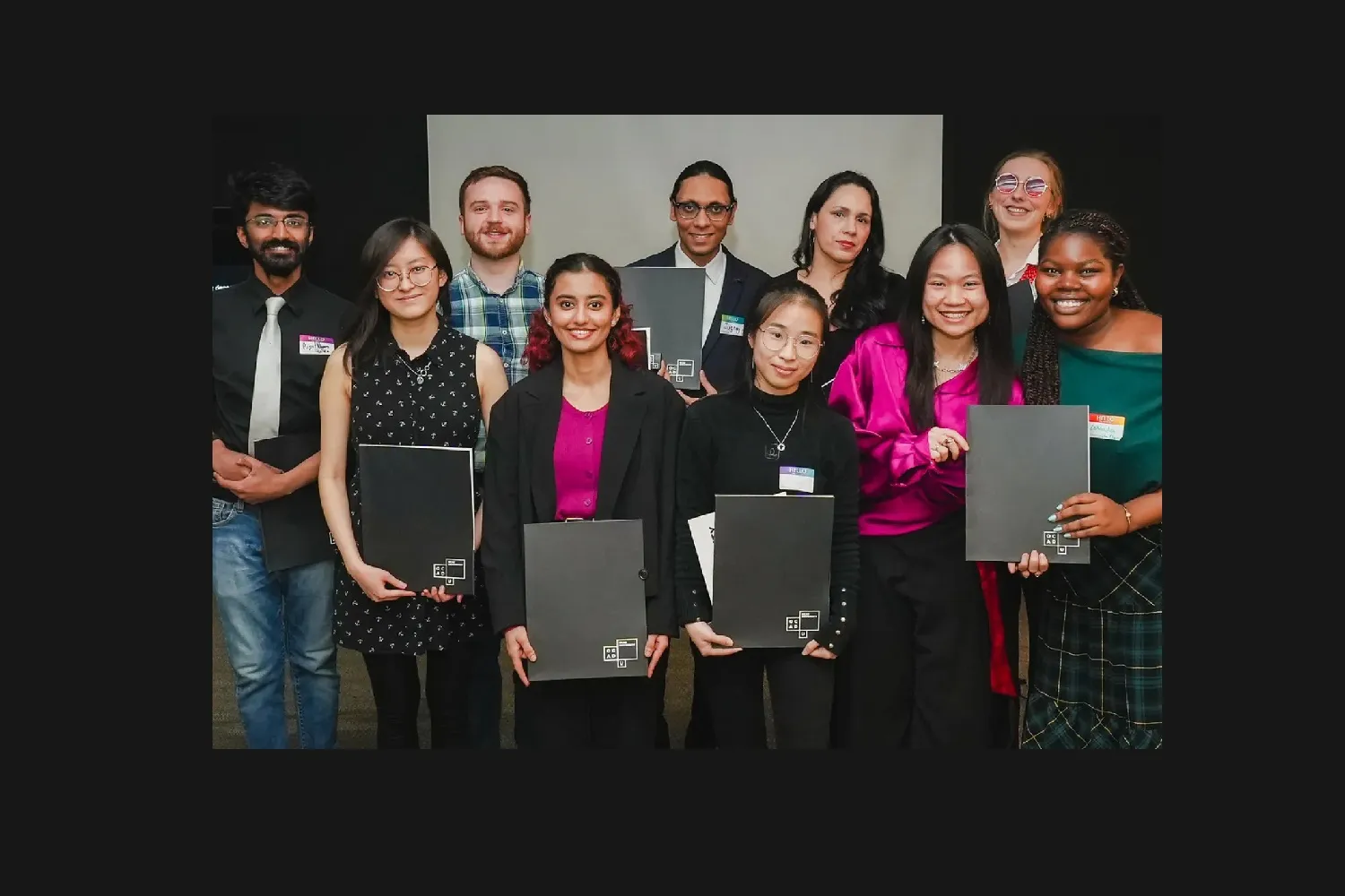 Students holding their awards