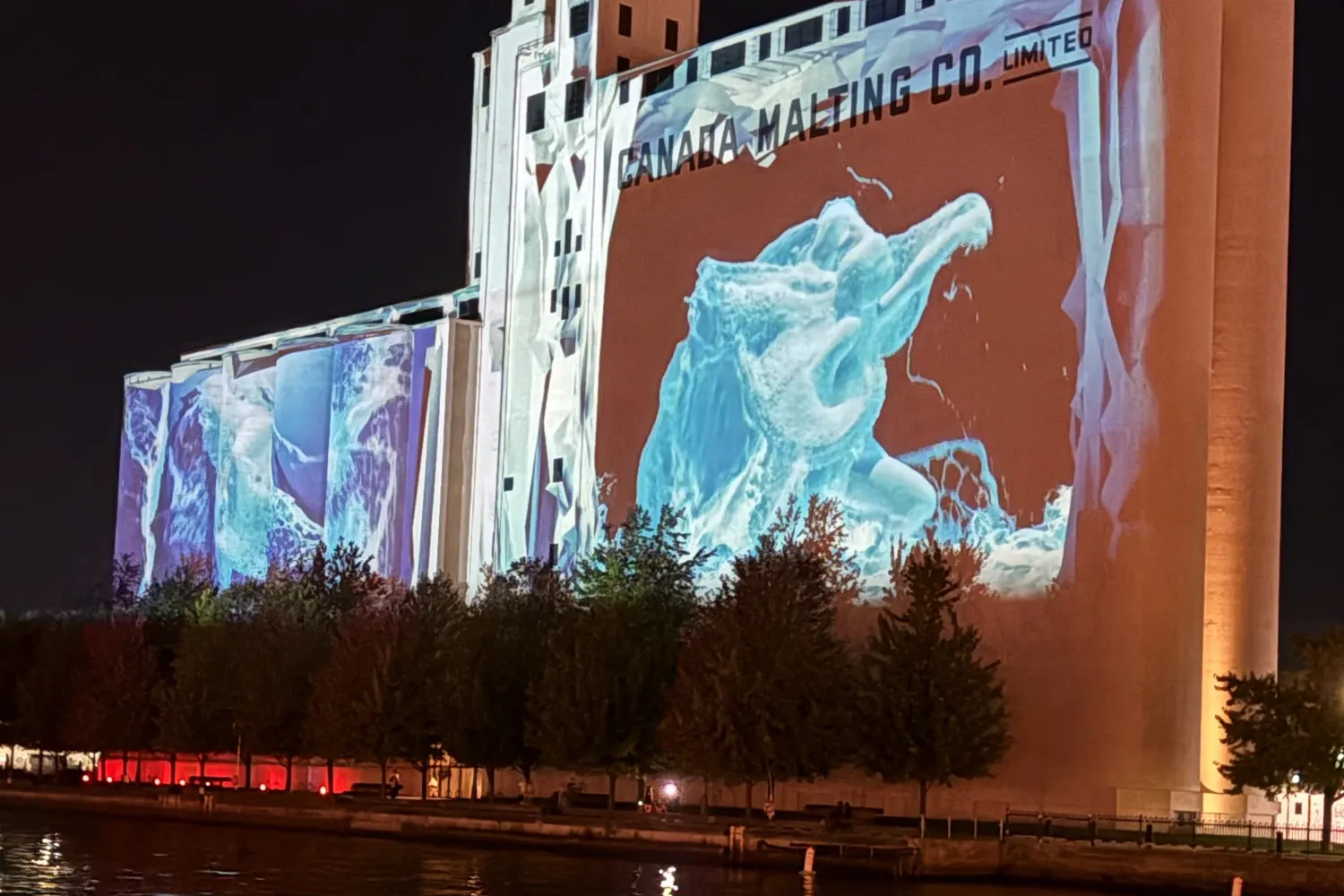 Image of Canada Malting Silos with projection of artwork.