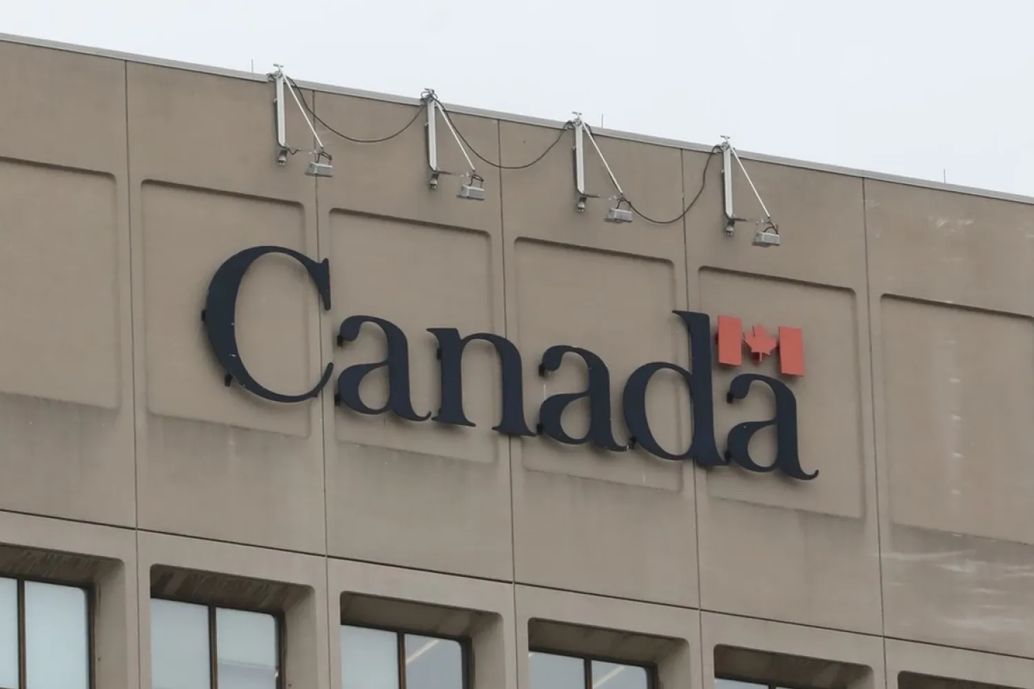 The Canada wordmark sits on a government building downtown. Photo by Jean Levac, Postmedia.