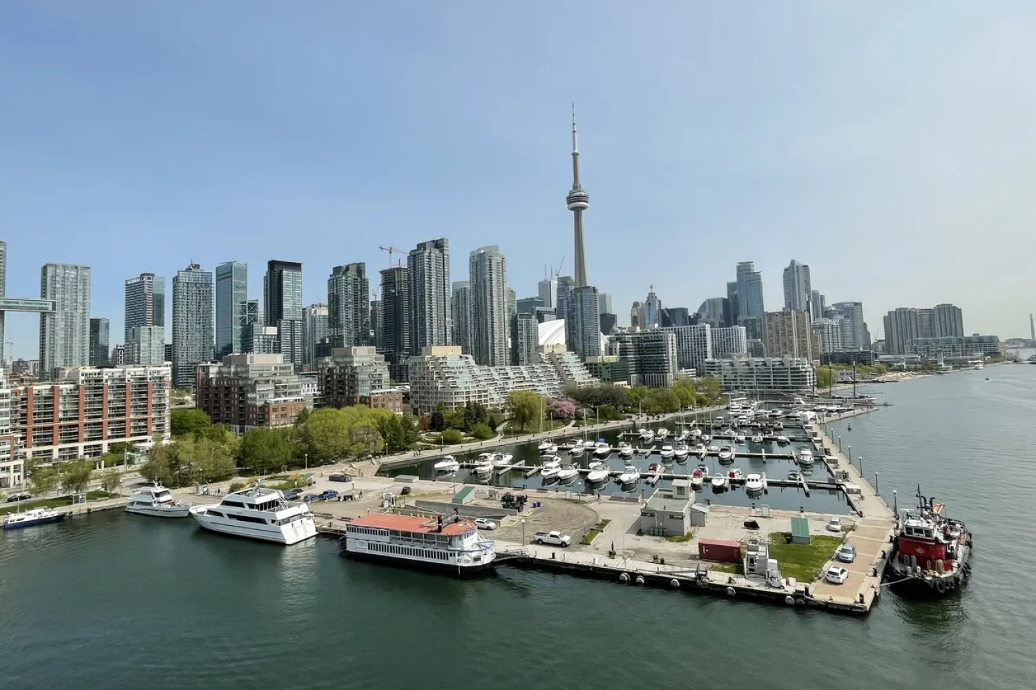 Photo of Toronto's Marina Quay West pier with CN Tower and city in the background