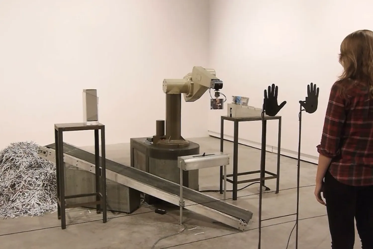 An metal floor based installation with participant standing in front