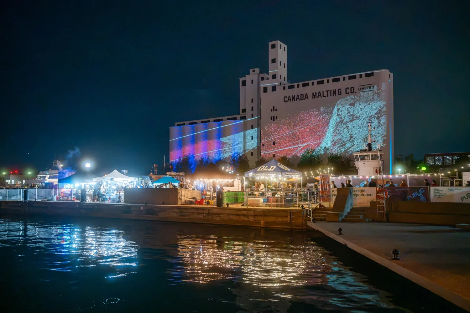 SILO NIGHTS at night as part of Public Pier, waterfront, Canada Malting Silos in background