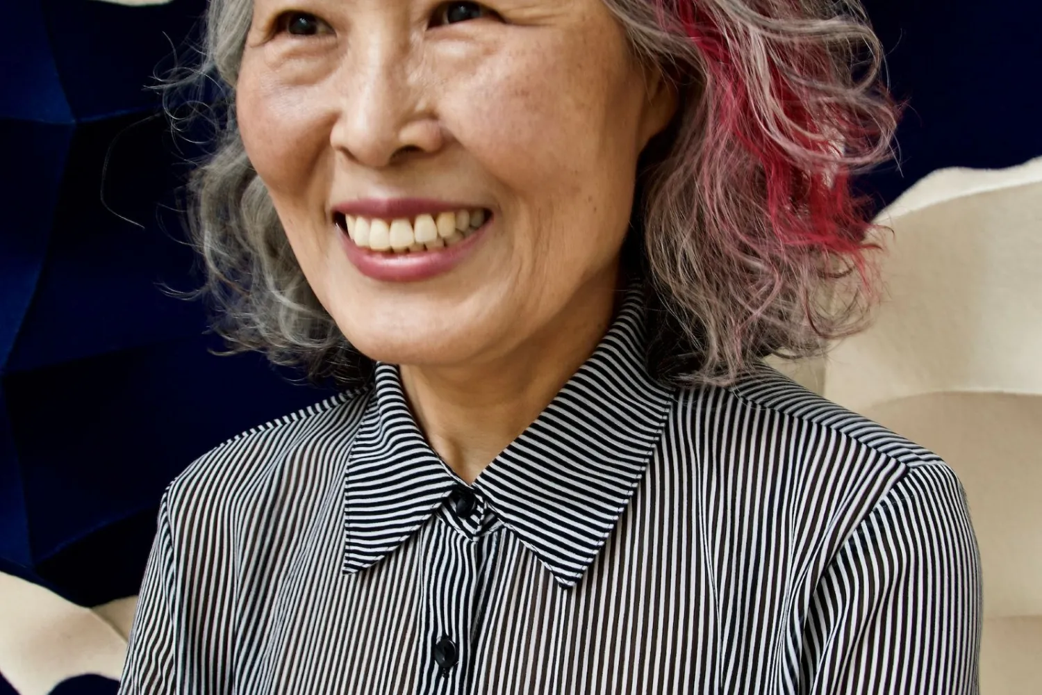 Chung-Im Kim wearing black and white shirt.