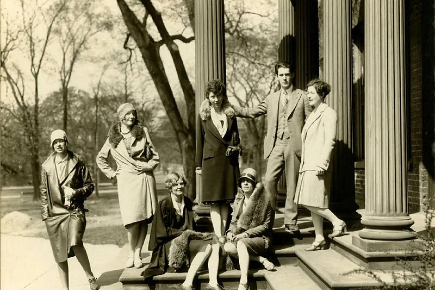 Women and men in 1920s clothing outside George Reid House