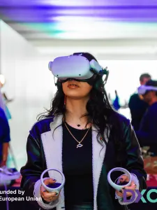 A woman stands with Meta Oculus 