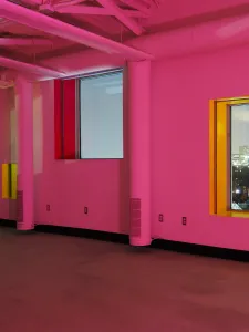 Interior of the Sharp Center, with walls drenched in pink lights