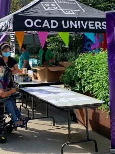 Students at an information tent.