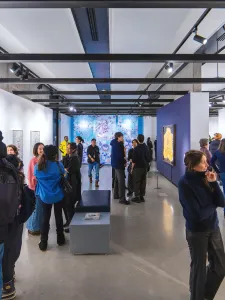 Visitors admire artworks at Onsite Gallery