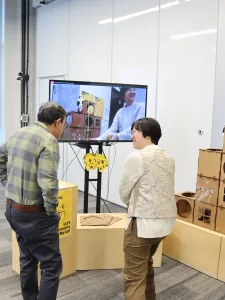 Two people looking at an art installation