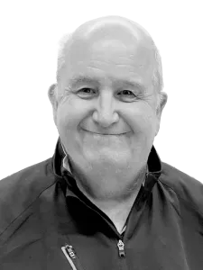 Bald man smiling wearing shirt with zipper