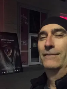 Photo of Charles Marchand wearing a black hat.