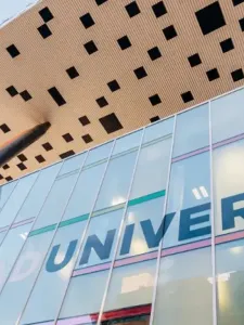 Image of OCAD U tabletop with glass windows showing the word, University