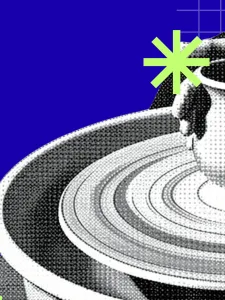 A potter throwing a pot on the pottery wheel