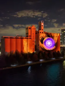 Artwork project on Canada Malting Silos, orange with a purple circle