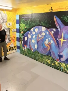 Mural of a fawn in yellow staircase