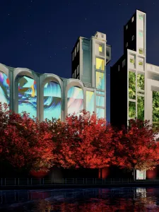 Artwork projected on Canada Malting Silos, with red trees in foreground