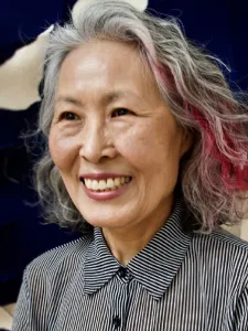 Chung-Im Kim wearing black and white shirt.