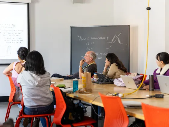 Students in a seminar room listening to a lecture