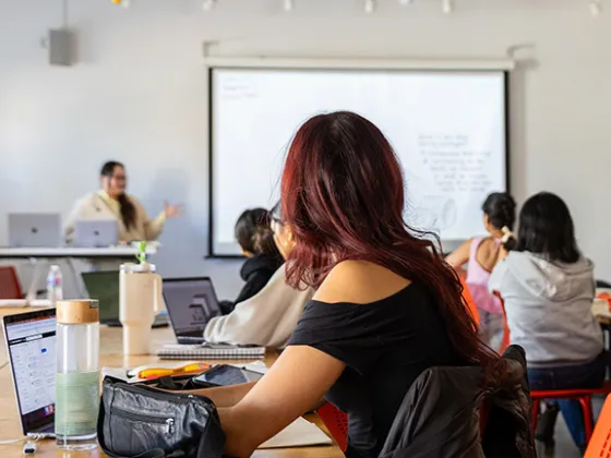 Students in a seminar room with laptops