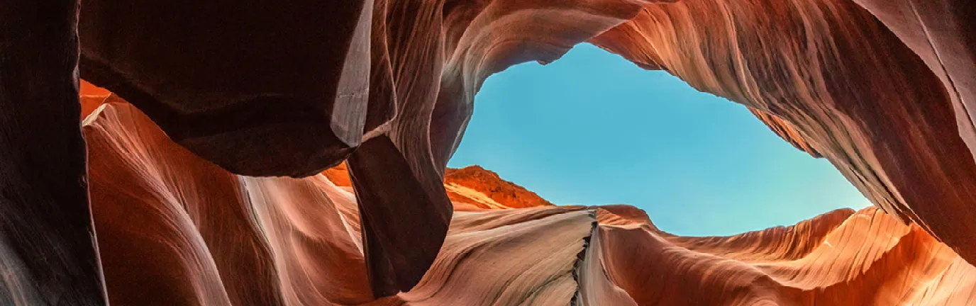 View of sky looking up through a canyon