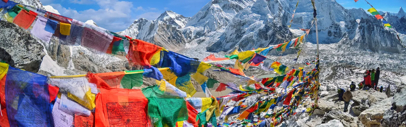 Mt. Everest and surrounding area with lots of colourful flags