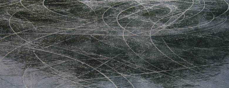 skate marks on a frozen surface