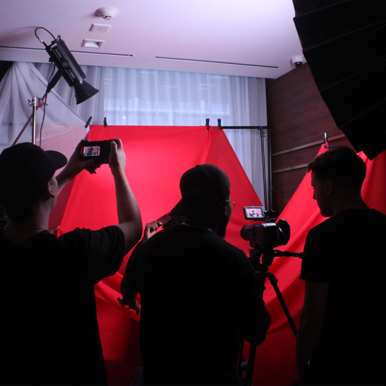 image of 3 people shooting in a production studio. 