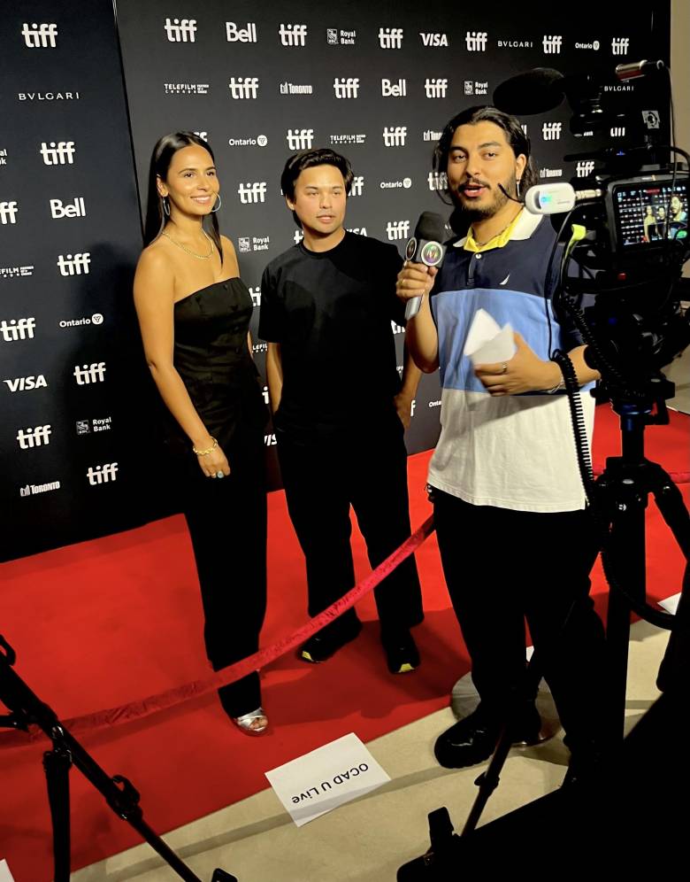 OCAD U LiVE’s Elmer Bauman-Enriquez on the red carpet (at right) interviews writer-director James Michael Chiang (centre) and producer Aasttha Khajuria (left) of the short film, Xie Xie, Ollie at a TIFF press event in mid-August celebrating Canadian films at the festival this year.