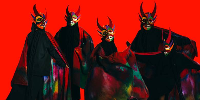 Pixel Heller, “Community of Masqueraders in Motion” (2023). Five figures in masks and dark outfits against a red background.