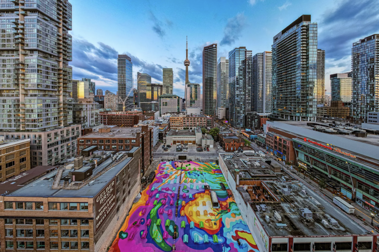 A photo of Toronto's skyline with a colourful and massive outdoor patio in the centre.