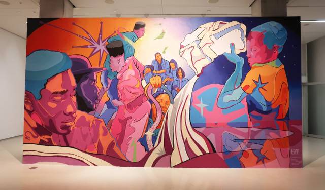 Milk n Honey mural by Curtia Wright. A colourful mural includes oranges, purples and blues, and depictions of people that center Black stories.
