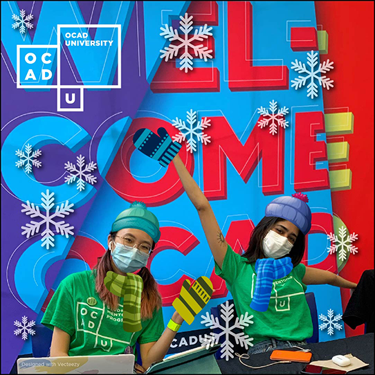 Image description: photo of two student Peer Mentor/Welcome Squad leaders sitting at a lobby welcome table, in front of a large colourful banner that says "Welcome OCAD U". Snowflakes and winter hats, scarves and mittens have been superimposed to keep the students warm. 