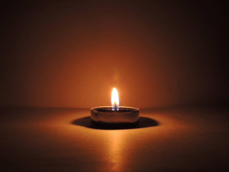 Single burning candle