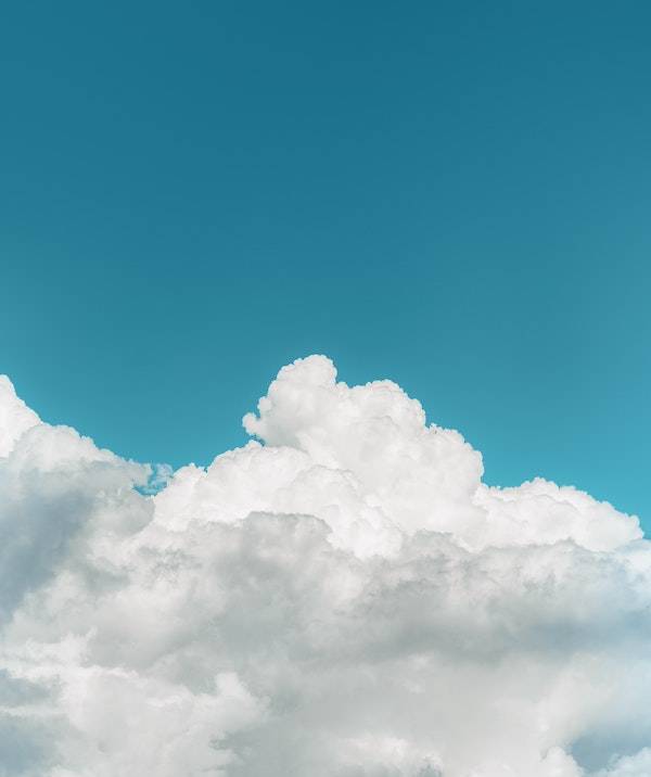 A photo of a blue sky with a cumulus cloud