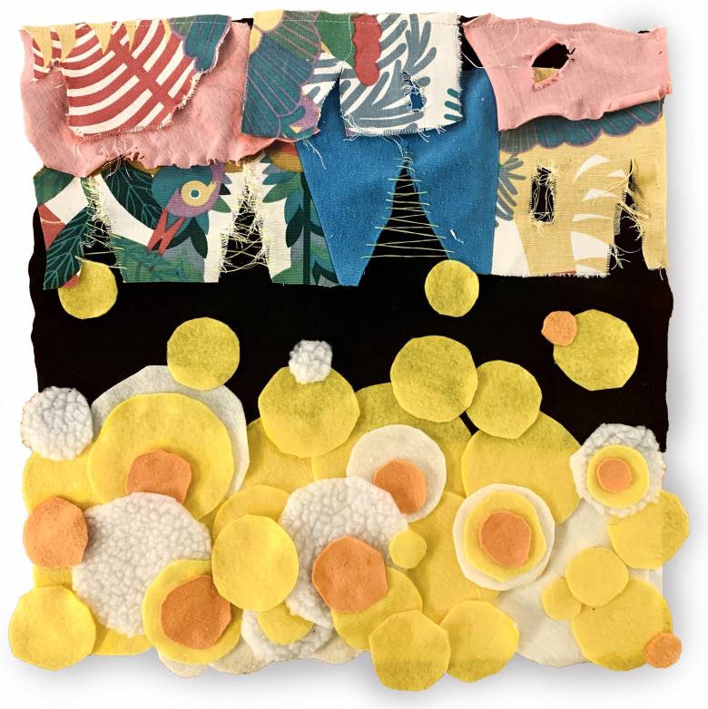 Artwork featuring fabric of yellow circles at the bottom with blue and other colours featured at the top