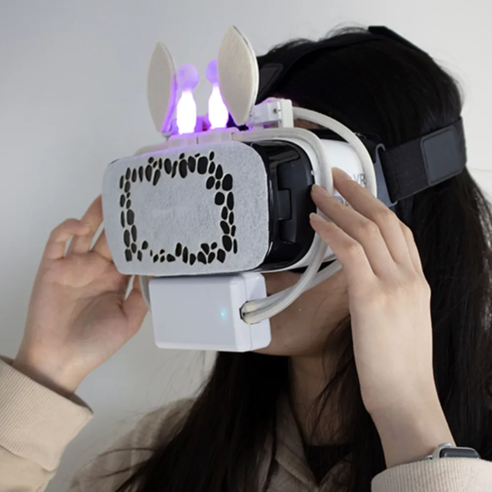 Person wearing VR headset with rabbit ears