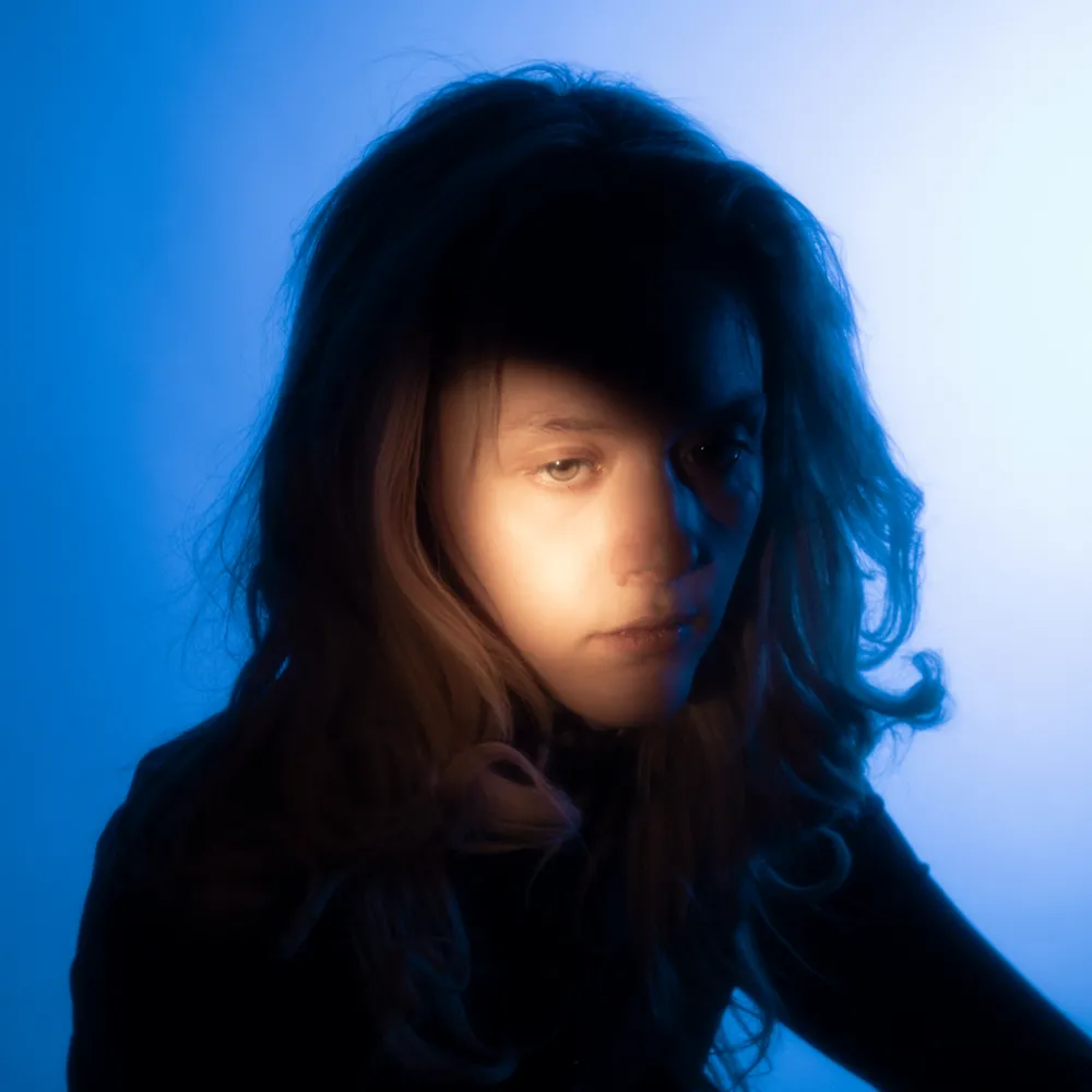 Portait on a blue lit background
