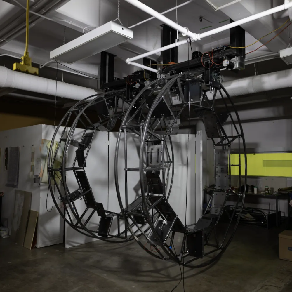 Photo of a metal sculpture hanging from the ceiling in a metal shop