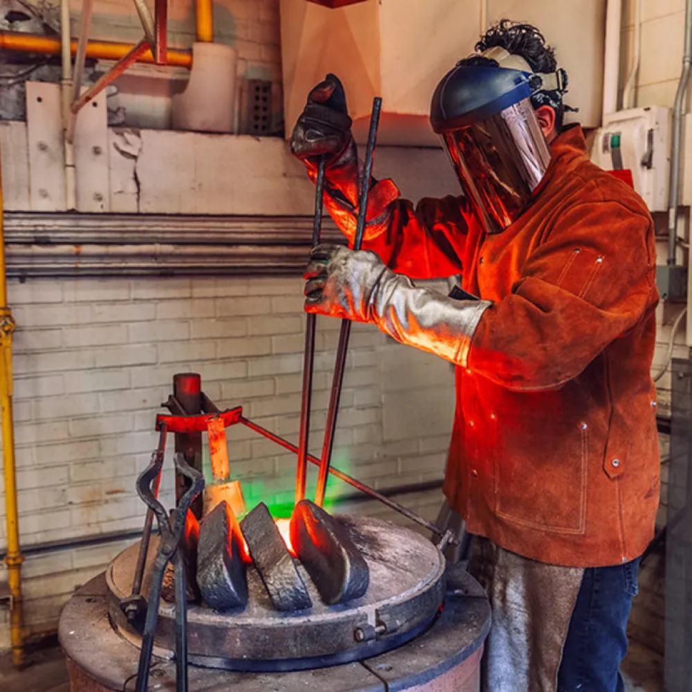 Student working in the foundry