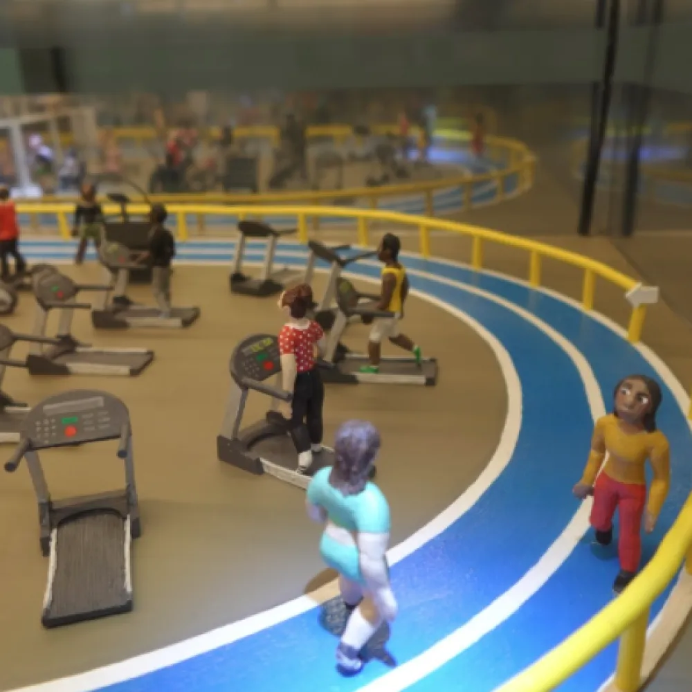 Clay figures working out in a gym