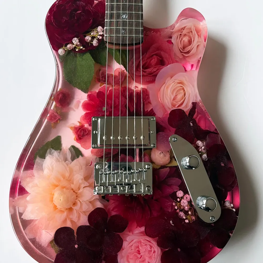 Resin guitar with flowers in it