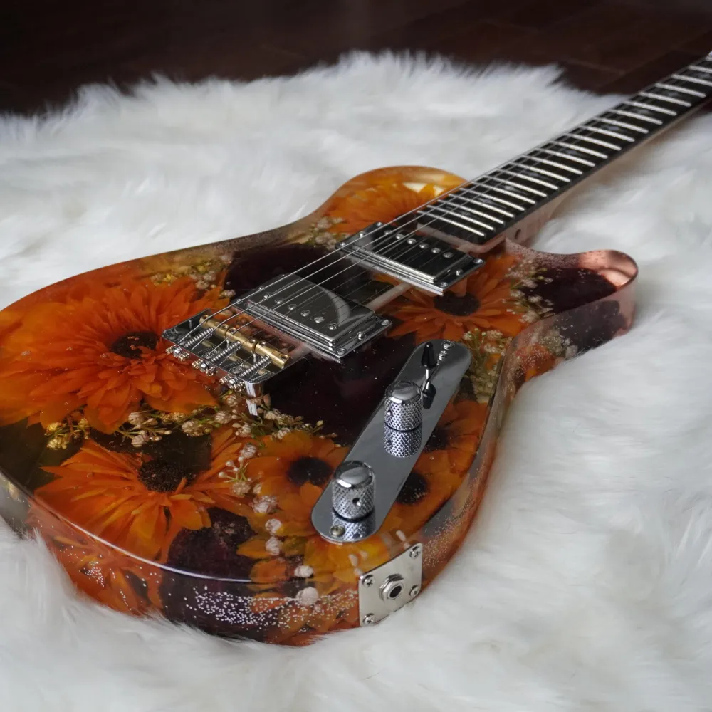 Resin guitar with flowers in it