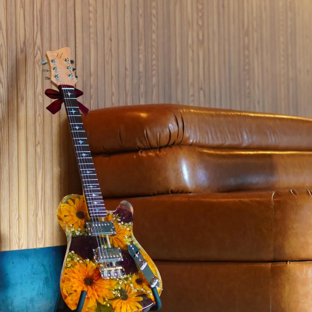 Resin guitar with flowers in it