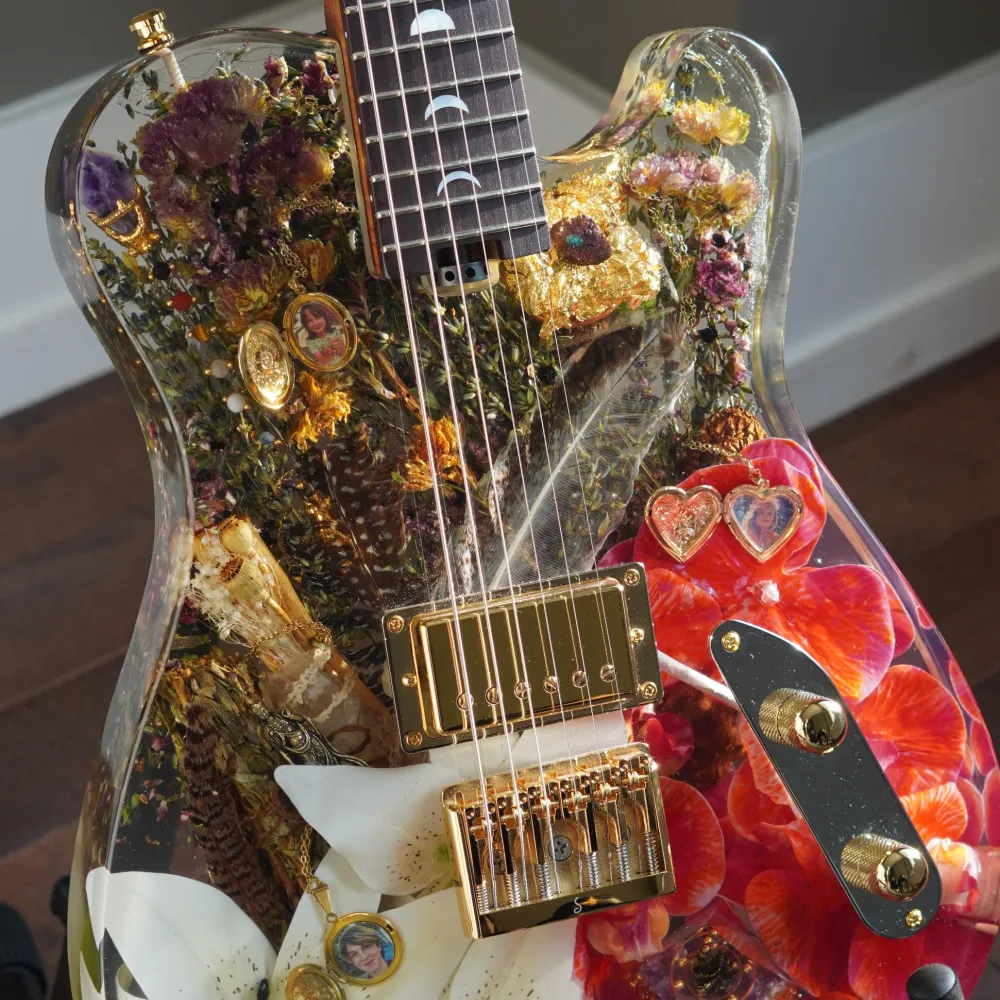 Resin guitar with flowers in it