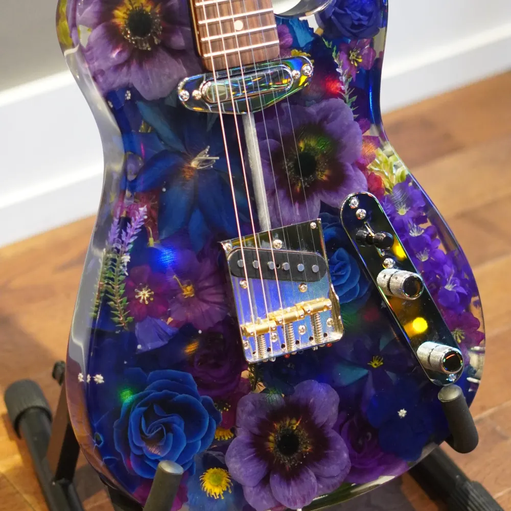 Resin guitar with flowers in it